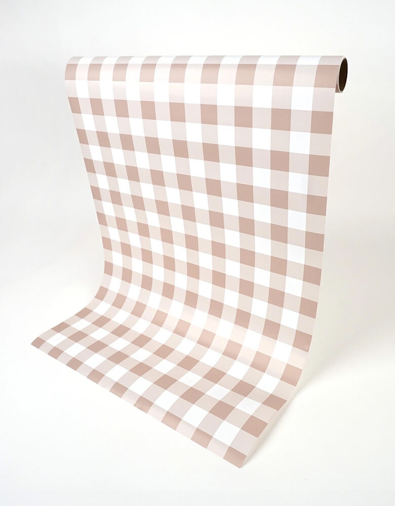 Momo Party's 18" x 120"  Brown Gingham Paper Table Runner by Gatherings. Bring the merriest of moments to your holiday table with this stylishly plaid brown gingham table runner! From buffets to family dinners, this festive pattern will add a touch of classic, cozy charm that will warm up any home. Perfect for the fall holidays! Add a ravishing look to your table top with our uniquely created table runners, making your table appear more lavish. Our table runners are 100% recyclable which helps with a swift!