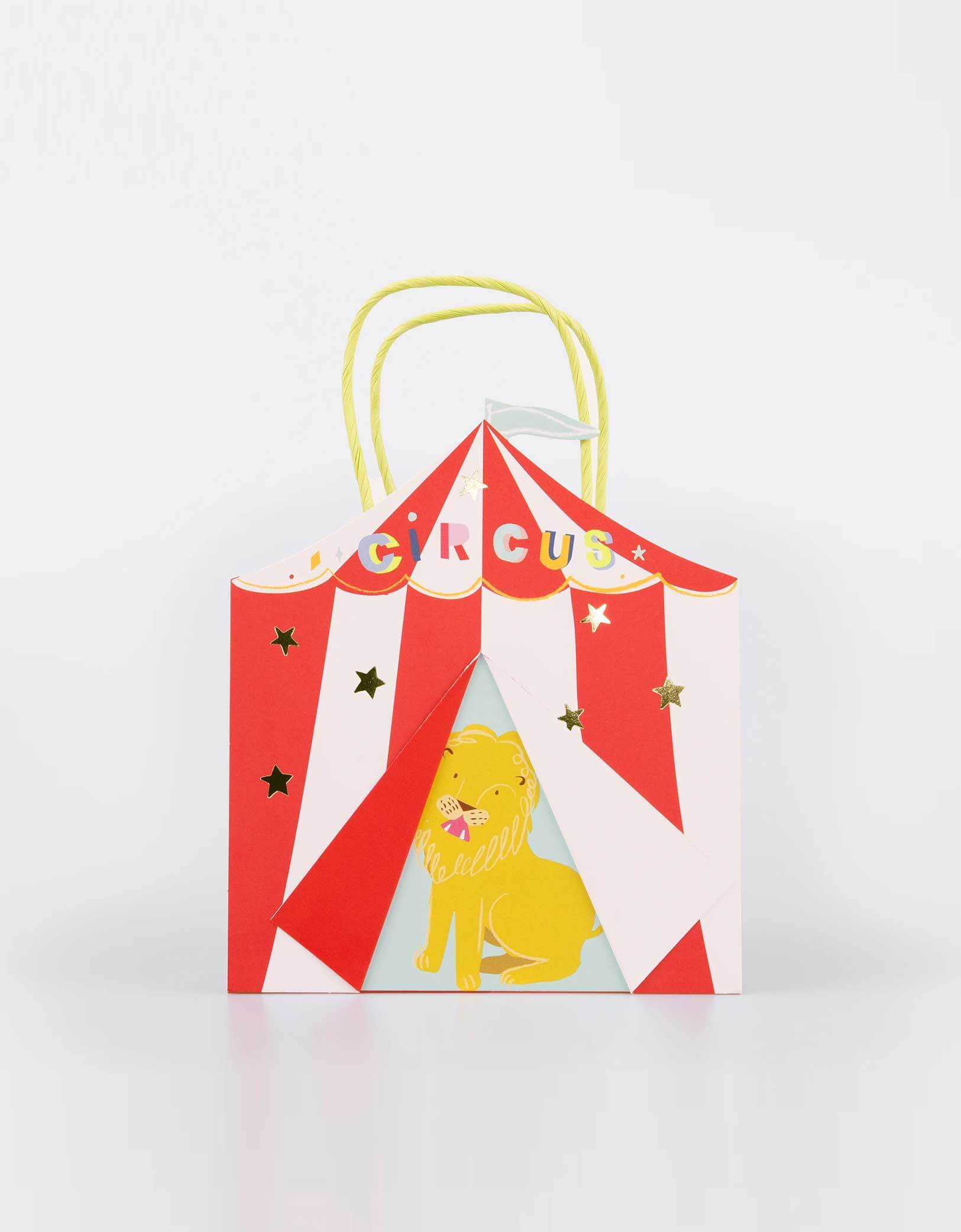 Momo Party's Circus Party Bag by Meri Meri. Comes in a set of 8 paper bags, these bags are cleverly designed and crafted to look like a big top, with a cheeky lion peeking out. Perfect to fill with circus party gifts and treats, and to use as a fun storage bag afterwards too.