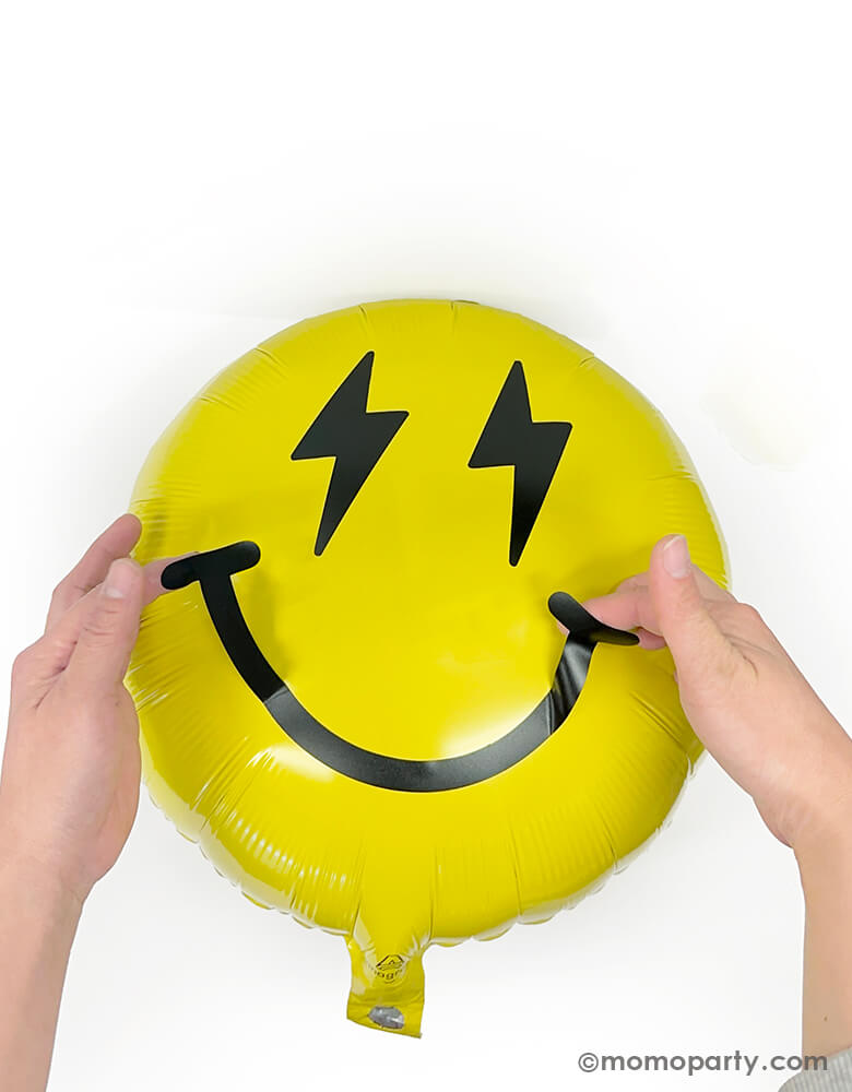 Discover the Cool Dude Smiley Foil Balloon Kit by Momo Party. This kit includes an 18" yellow round foil balloon adorned with lightning bolt eyes and a smiley face vinyl sticker. Simply inflate the round foil balloon and apply the stickers to the center to create a super rad decoration! Perfect for a boy's 'One Happy Dude' themed first birthday, a 'Two Cool' themed second birthday party, 'Ten Rad Years' 10th birthday celebration, or any modern kids birthday party and celebration.