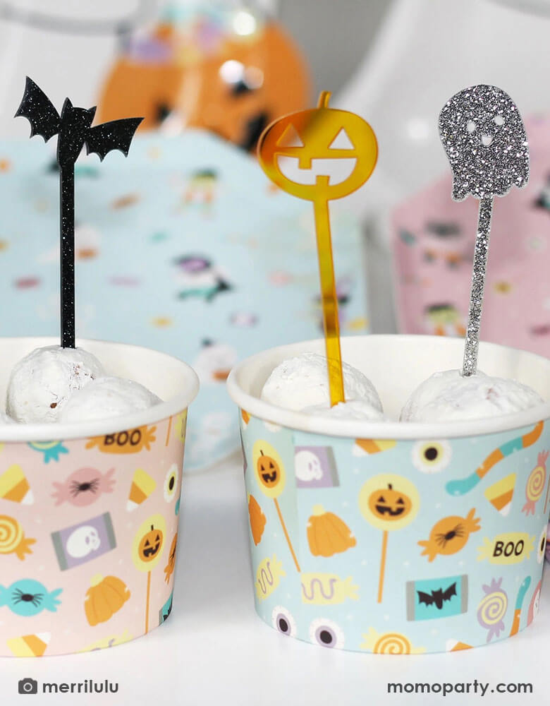 A couple of Halloween snack cups filled with donut walls topped with Momo Party's Halloween Monsters Mash acrylic food picks which feature a skull, a bat, a pumpkin and a ghost. They're perfect for kid's friendly Halloween celebration, a trick or treat party or a Halloween boothday!