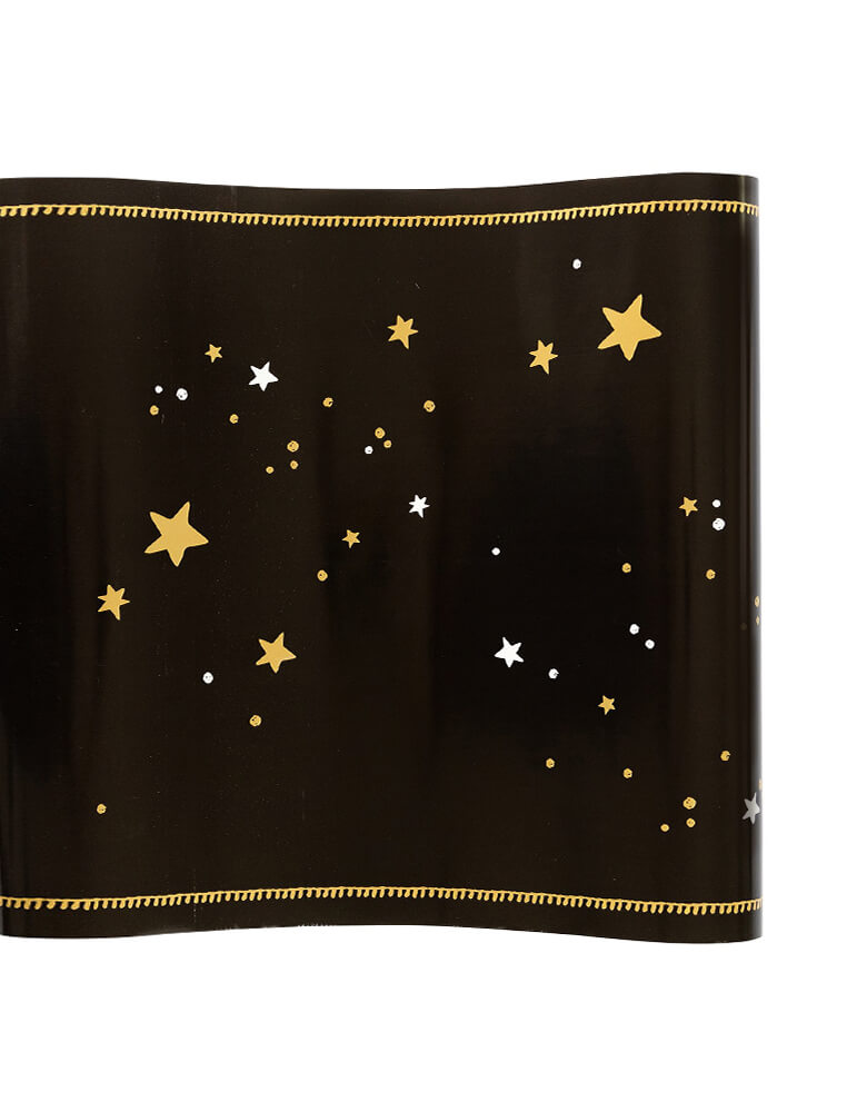 Momo Party's 16 inches x 10 ft Mystical Stars Table Runner by My Mind's Eye. Featuring gold and white shimmer stars in the black runner, this table runner creates a mystifying tablescape that party goers will find to escape at your Halloween party, graduation party, new year or any celebration.