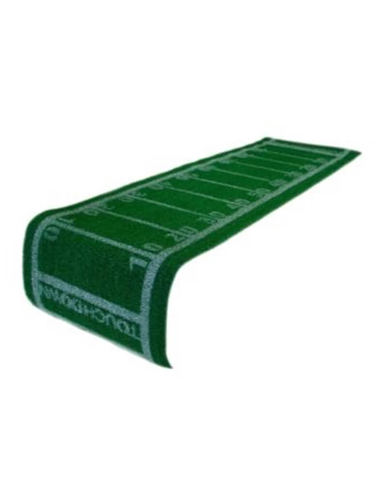 Momo Party's 5ft x 16 inches Football Turf Table Runner by Talking Tables. Decorate your table for game day with this amazing&nbsp;Football Turf Table Runner. This grass runner features yard line markings and touchdown zones just like a football field. Layer this table runner on top of your party table cover to complete your tablescape. Perfect as a football party decoration for the Super Bowl party, game day or a kid's football-themed birthday party.