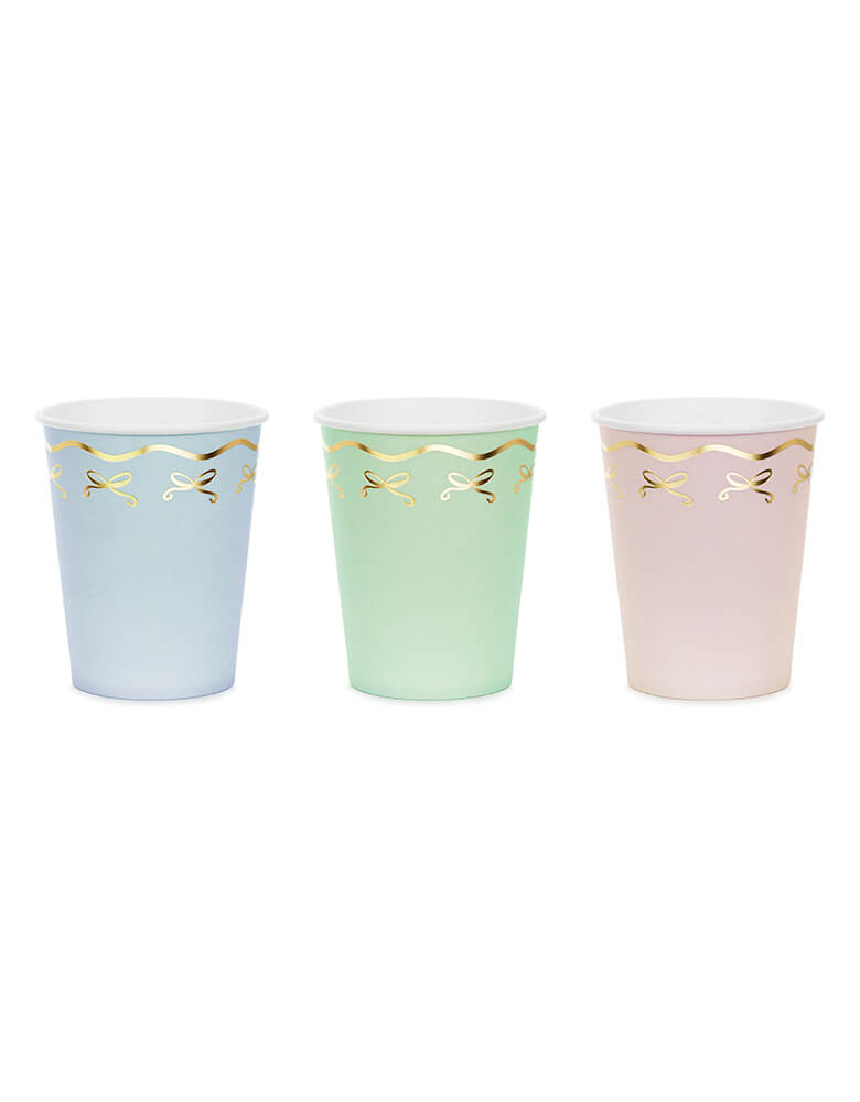 Momo Party 7.4 oz Pastel Coquette Bow Cups by Party Deco. Comes in a pack of 6 party cups in 3 pastel colors, add an elegant touch to your party with these gorgeous pastel coquette bow cups. These charming paper cups feature soft pastel colors and a delicate gold foil coquette bow design. Perfect for any celebration, these cups are sure to impress your guests.