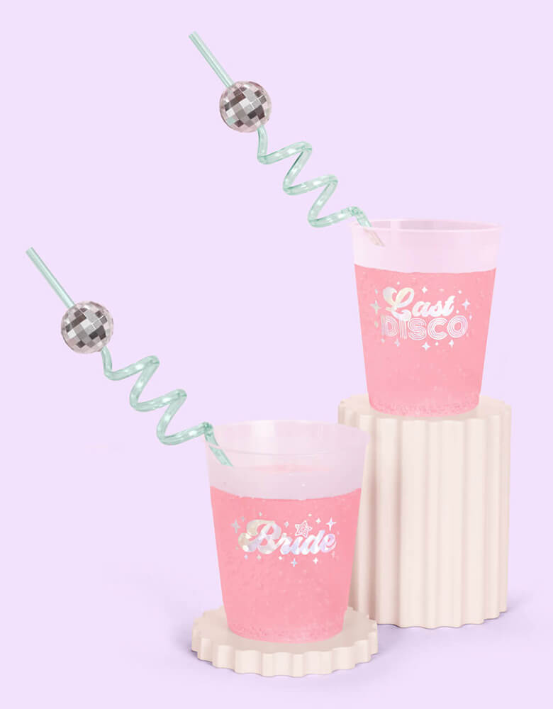 Momo Party's 10" Reusable Disco Party Swirly Straws by Xo, fetti in two disposable cups with Let's Disco and Bride on them.