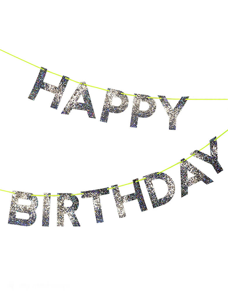 Momo Party's 8ft Silver Happy Birthday Garland by Meri Meri. This spectacular Happy Birthday garland, spelling out a cheery message of good wishes in chunky holographic silver glitter on a neon cord - the perfect way to add a little extra sparkle!