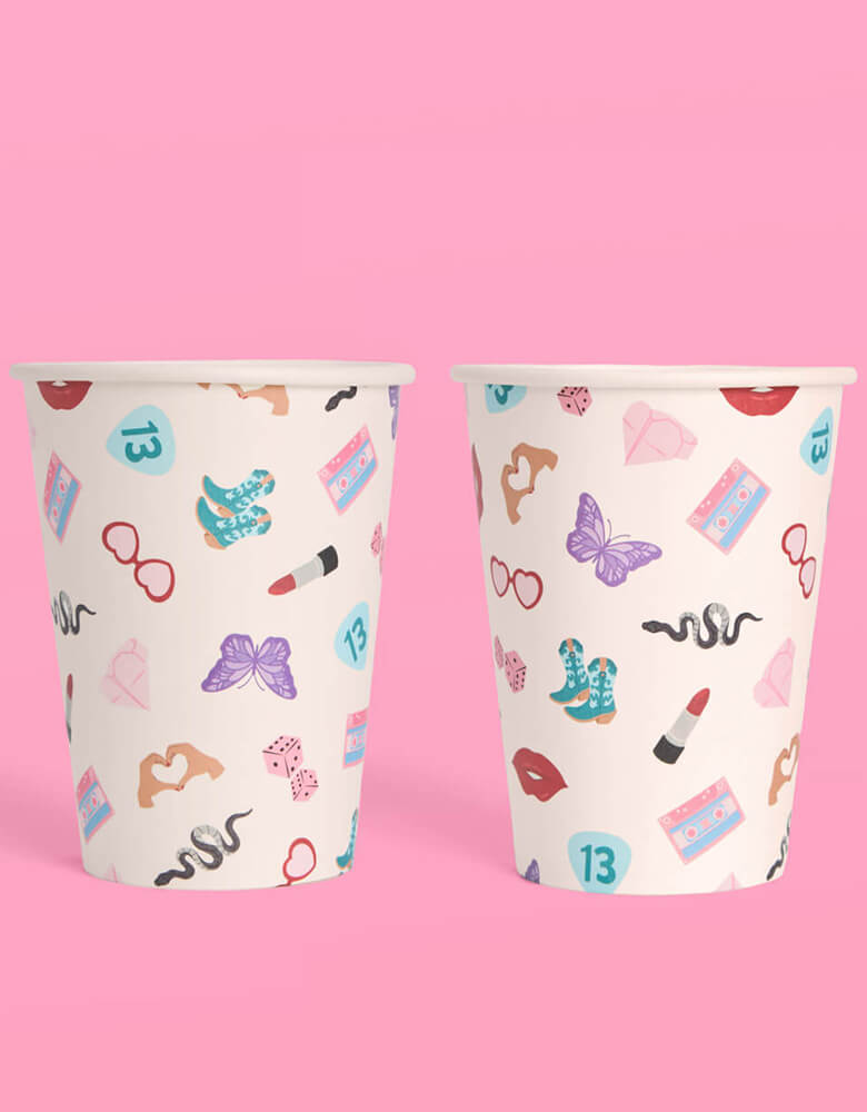 Momo Party's 12oz Taylor Swift Era's Party Paper Cups by Xo, Fetti. Comes in a set of 18 party cups, spice up your party with these Taylor Swift-inspired paper party cups! Your guests will be singing and dancing to the beat of these party cups featuring the iconic Taylor Swift-themed designs including snakes, butterflies, red lipsticks and more.