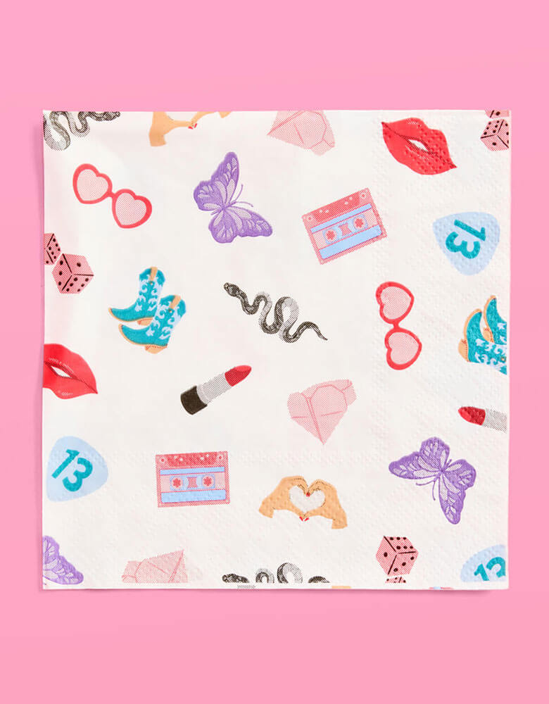 Momo Party's 5" x 5" Taylor Swift Era's Party small napkins Xo, Fetti. Comes in a set of 25 napkins, these napkins have a Taylor Swift inspired motif featuring red lipstick, red lips, butterflies, cowgirl boots, snakes, cassette tapes, guitar picks, heart hand symbols, and heart shaped sunglasses.  They're perfect for the party table celebrating your Swiftie girl's special day. 