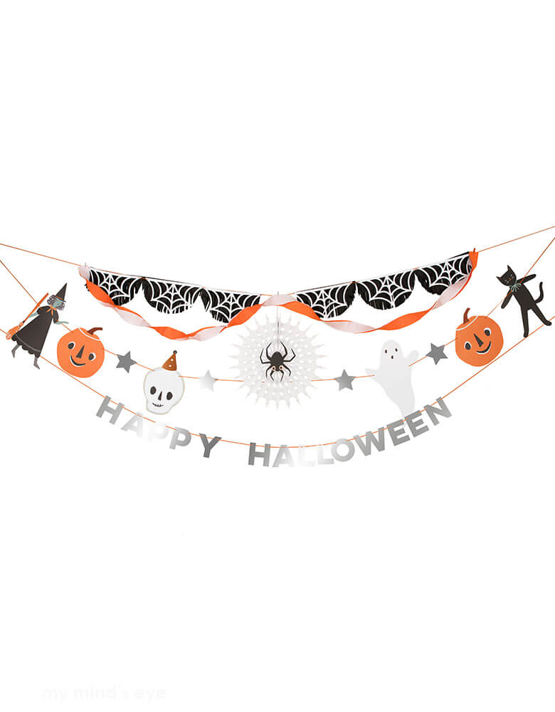 Momo Party's 7ft It's Halloween! Party Garland by Meri Meri. The garland is split across. Garland 1 has 2 crepe paper streamers in white and orange, 2 spider web tissue paper tassel swags and a honeycomb tissue paper cobweb pinwheel with a spider on a string. Orange and white mini pegs and a white paperclip are provided to secure the streamers and pinwheel Garland 2 has 10 pre-strung Halloween character and icon paper pennants Garland 3 has pre-strung Happy Halloween paper letters.